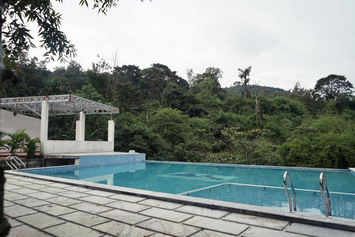 Hotel Coorggavadana à Madikeri Extérieur photo
